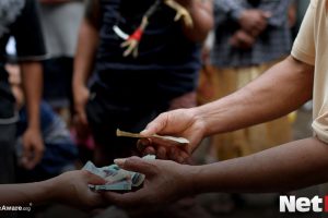 Men handling money in a casino
